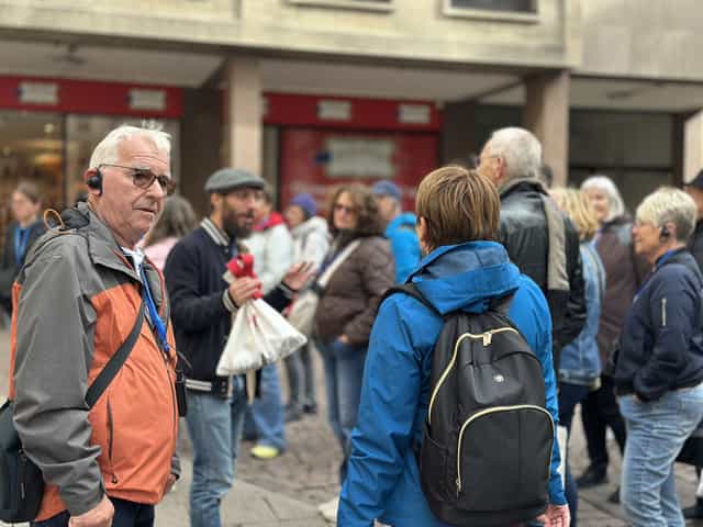 Walking-tour guests gathered on a pedestrian street in Strasbourg