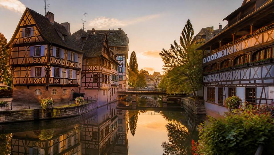 The Petite France canals in Strasbourg at sunset, the starting point of every VéloRouge electric bike rental.