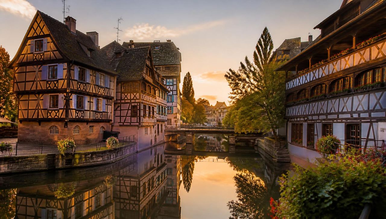 The Petite France canals in Strasbourg at sunset, the starting point of every VéloRouge electric bike rental.